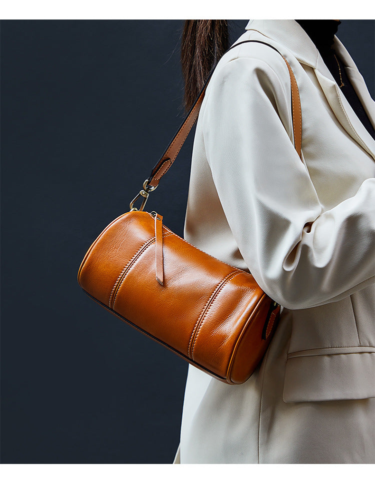 Ladies retro cowhide broadband cylindrical bag underarm bag simple temperament shoulder bag that goes with anything. Pochette